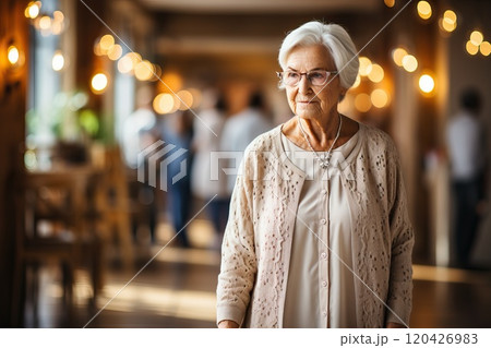 An elderly woman with a facial expression that signifies her understanding and acceptance of her old age. 120426983