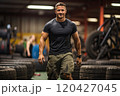 Male athlete in the gym with car tires. 120427045