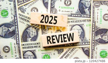 Planning 2025 review new year symbol. Concept words 2025 Review on beautiful wooden blocks. Dollar bills. Beautiful background from dollar bills. Business 2025 review new year concept. Copy space. Planning 2025 review new year symbol. Concept words 2025 Review on beautiful wooden blocks. Dollar bills. Beautiful background from dollar bills. Business 2025 review new year concept. Copy space. 120427486