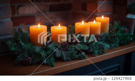 Candles on mantel with greenery and pine cones, cozy holiday decor concept 120427908