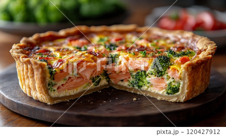 Savory salmon and broccoli quiche, close-up view. Delicious homemade baking and culinary concept 120427912