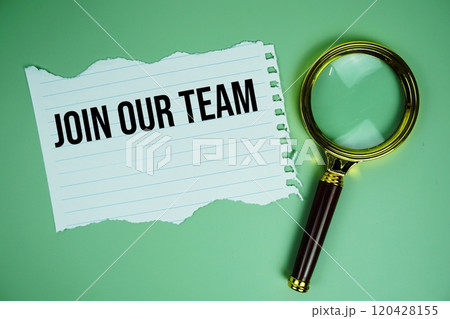 Join our team text on paper torn with magnifying glass top view on green background 120428155