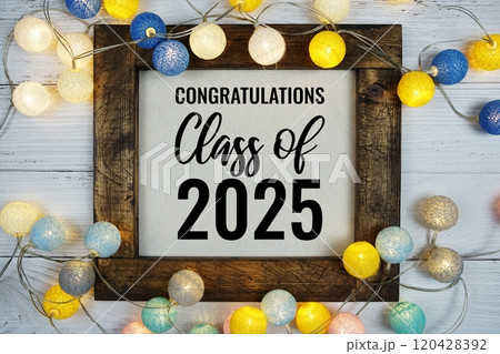 Class of 2025 text with Colorful LED cotton ball decorative on wooden background Class of 2025 text with Colorful LED cotton ball decorative on wooden background 120428392