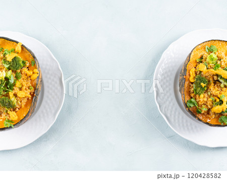 Stuffed kabocha squash with quinoa, broccoli and chickpea pumpkin hummus 120428582
