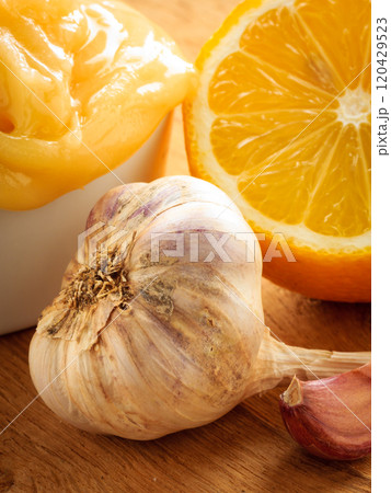 Honey garlic and lemon on wooden rustic table. 120429523