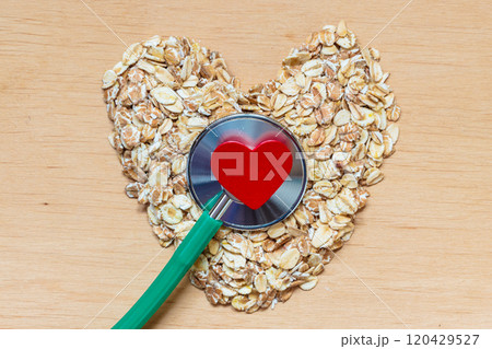 Oat flakes heart shaped and stethoscope. Oat flakes heart shaped and stethoscope. 120429527