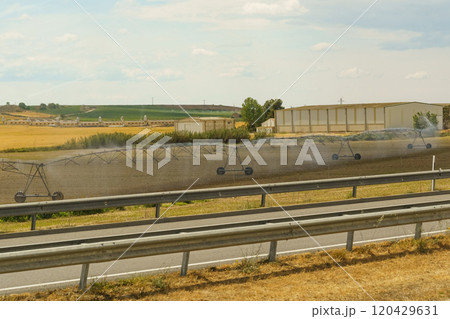 Irrigation of the field with water using special equipment 120429631