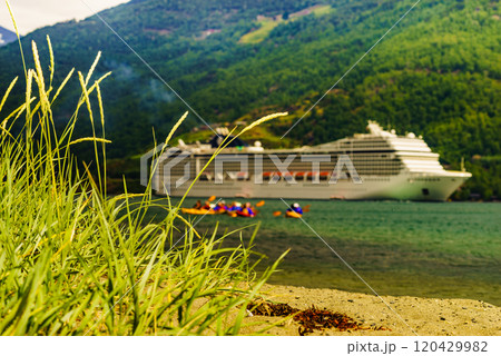 Fjord with kayaks and cruise ship Flam, Norway Fjord with kayaks and cruise ship Flam, Norway 120429982