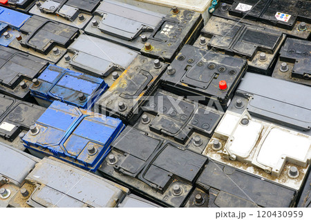 Stack of many used car batteries for recycling in a hazardous waste facility 120430959