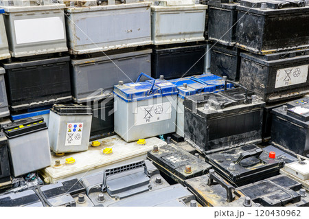 Stack of many used car batteries for recycling in a hazardous waste facility Stack of many used car batteries for recycling in a hazardous waste facility 120430962