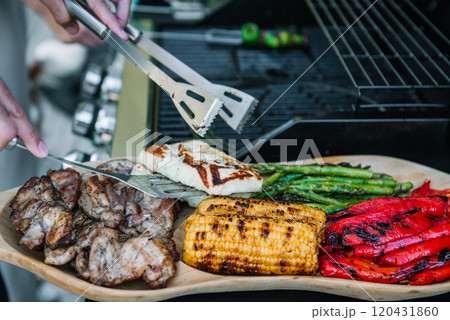 Grilled chicken, corn cobs, paprika, asparagus and halloumi cheese. Grilled chicken, corn cobs, paprika, asparagus and halloumi cheese. 120431860