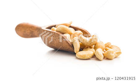 Roasted cashew nuts in scoop isolated on white background. Roasted cashew nuts in scoop isolated on white background. 120431915