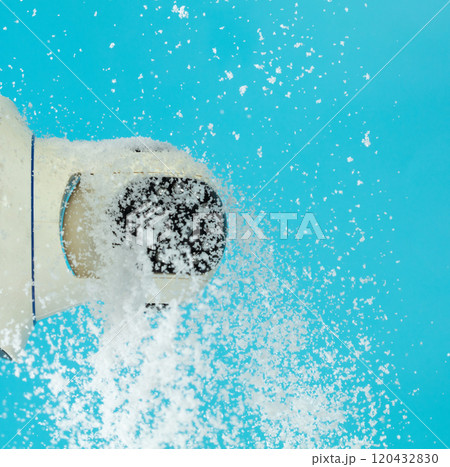 Surveillance CCTV as security camera to record and monitor outdoors of house got snow falling. Snow falling on Surveillance CCTV security camera over blue sky background isolated 120432830