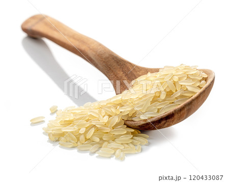 spoon of raw rice 120433087