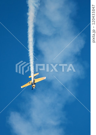 Stunt aerobatic plane performing stunts in air 120433847
