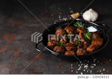 Meatballs in a black bowl on a dark background 120436523