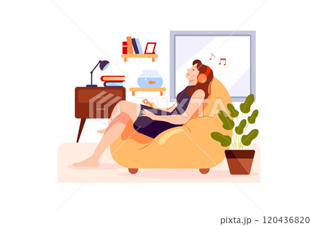 The girl is relaxing on the couch and listening to the music 120436820