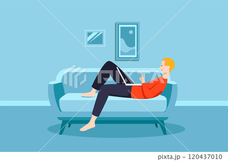 Man working on his laptop on the sofa at home 120437010