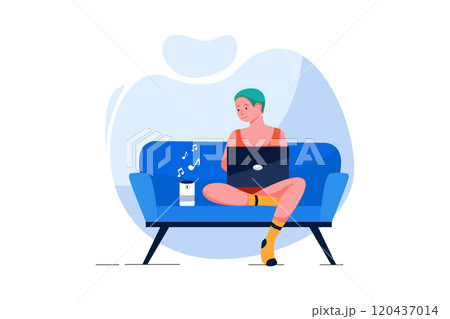 Man with laptop listening to music on wireless speaker at home 120437014
