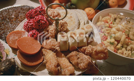 A platter featuring kutsinta, ampaw, hopia, chikalang and piaya which are traditional Filipino desserts served during the New Year's eve feast or Media Noche in the Philippines A platter featuring kutsinta, ampaw, hopia, chikalang and piaya which are traditional Filipino desserts served during the New Year's eve feast or Media Noche in the Philippines 120440070