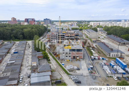 Aerial view of cranes at the construction of an industrial building in Novosibirsk, Russia 120441246