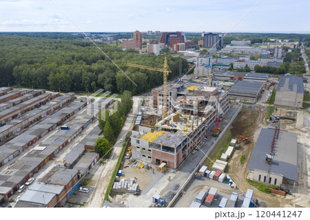 Aerial view of cranes at the construction of an industrial building in Novosibirsk, Russia 120441247