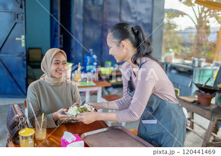 Warm Moments at a Cozy Caf Sharing Delicious Food and Smiles Warm Moments at a Cozy Caf Sharing Delicious Food and Smiles 120441469
