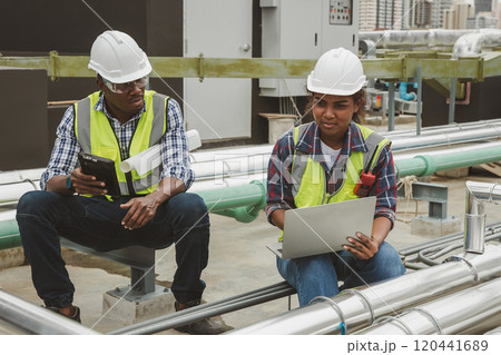 Team Engineers with draft plan of building on constructing site. Engineer work on site. engineer visit and inspection site engineer. Inspector engineer check and working on site. 120441689