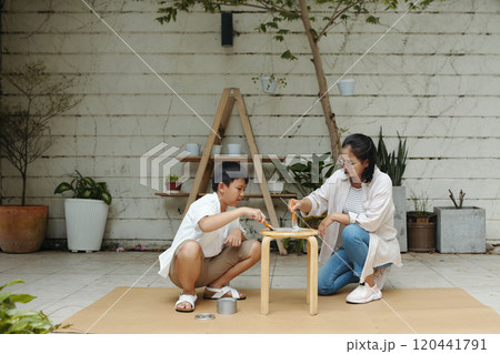 Crafting Wooden Projects in Outdoor Workspace Setting Crafting Wooden Projects in Outdoor Workspace Setting 120441791