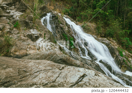 waterfall in summer scene, bright sunrise shining on the waterfall 120444432