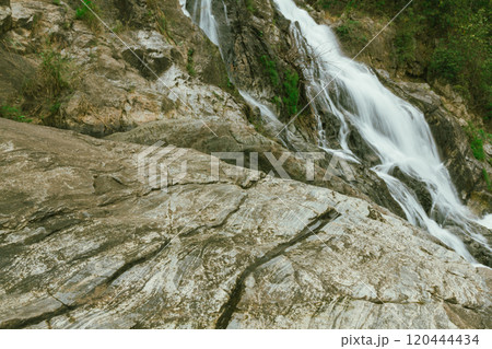 waterfall in summer scene, bright sunrise shining on the waterfall waterfall in summer scene, bright sunrise shining on the waterfall 120444434