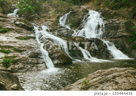 waterfall in summer scene, bright sunrise shining on the waterfall 120444436