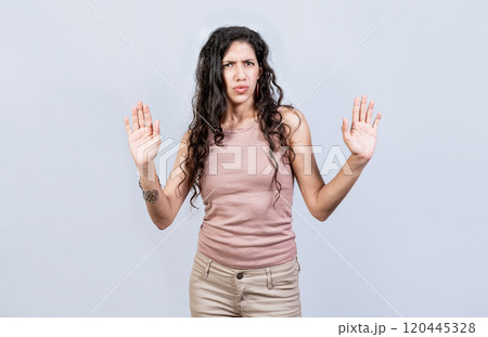 Scared woman with raised hands isolated. Young woman with scared face with raised hands, Scared and horrified girl with raised palms Scared woman with raised hands isolated. Young woman with scared face with raised hands, Scared and horrified girl with raised palms 120445328