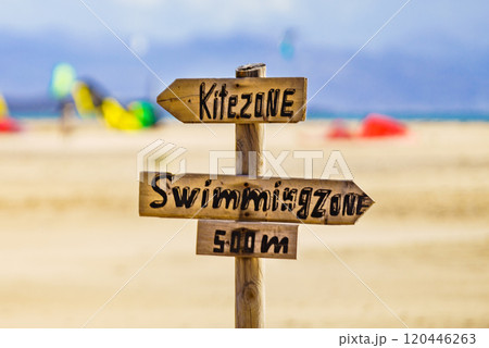 Kitezone and swimmingzone sign at beach. Kitezone and swimmingzone sign at beach. 120446263