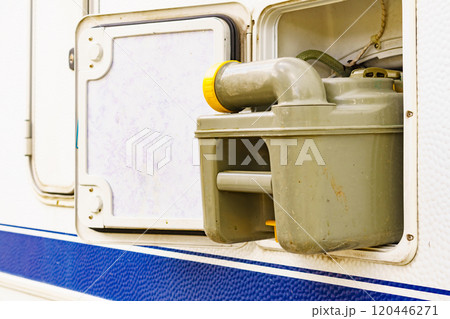 Serving caravan in dump station., tank toilet cassette Serving caravan in dump station., tank toilet cassette 120446271