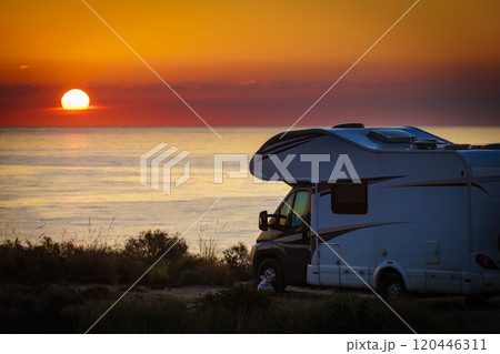 Caravan on sea at sunrise. 120446311