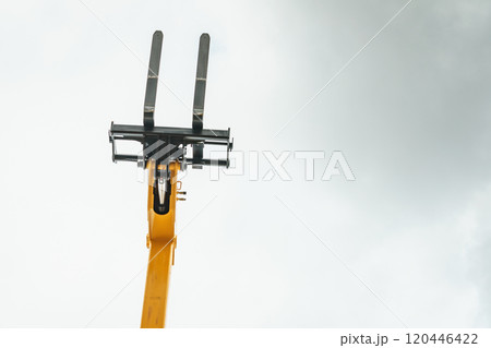 Forklift industrial loader or stacker against sky. 120446422