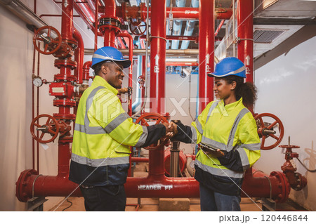 Engineer or technician work checking Fire suppression system and fire equipment. Engineer check red generator pump for water sprinkler piping and fire alarm control system Engineer or technician work checking Fire suppression system and fire equipment. Engineer check red generator pump for water sprinkler piping and fire alarm control system 120446844