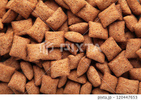 Chocolate pads corn flakes closeup background. Cereals texture. 120447653