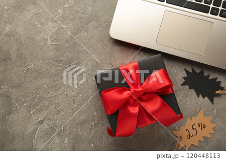 Black Friday. Online Shopping Concept with gift box on grey. Black Friday. Online Shopping Concept with gift box on grey. 120448113
