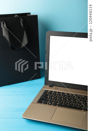 Black Friday Sale concept with laptop on blue background. 120448114