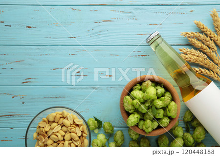 Beer, nuts and hops cones on grey background. Beer, nuts and hops cones on grey background. 120448188