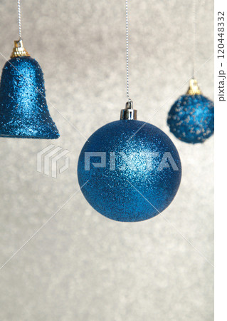 Shiny blue Christmas balls on glittering background. Shiny blue Christmas balls on glittering background. 120448332