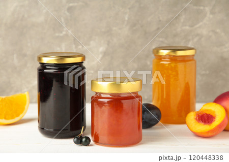 Homemade fruit jam in the jar on grey background. Top view Homemade fruit jam in the jar on grey background. Top view 120448338