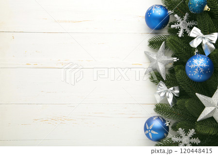 Fir-tree branches with christmas decorations on white background with copy space Fir-tree branches with christmas decorations on white background with copy space 120448415