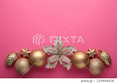 Gold Christmas decoration on pink background, top view, flat lay Gold Christmas decoration on pink background, top view, flat lay 120448416