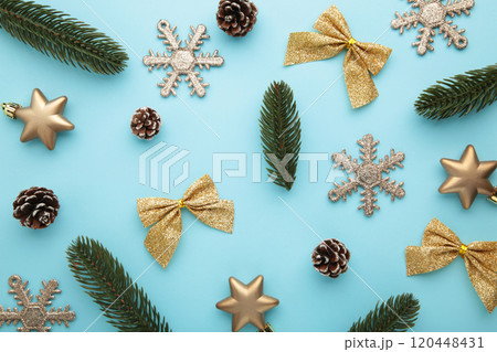 Christmas gold decoration on blue background. New Year composition Christmas gold decoration on blue background. New Year composition 120448431