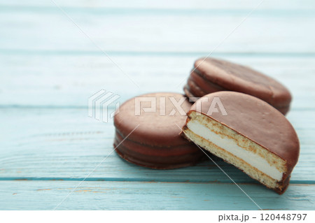Choco pie chocolate coated snacks on blue background. 120448797