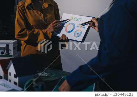 ESG environmental social governance display on laptop on eco-friendly company meeting with business people implementing environmental protection for clean and sustainable future ecology. Trailblazing 120449123