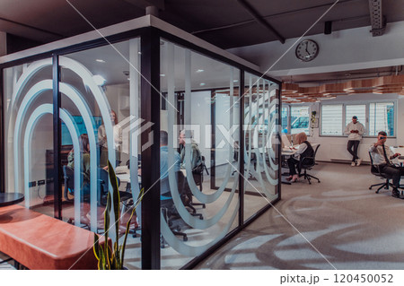 A group of young business entrepreneurs engages in a focused meeting, discussing various business strategies and collaboratively solving challenging problems, showcasing ambition, creativity, and A group of young business entrepreneurs engages in a focused meeting, discussing various business strategies and collaboratively solving challenging problems, showcasing ambition, creativity, and 120450052